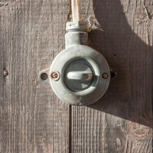 old-vintage-switch-wood-texture-wall-crop2